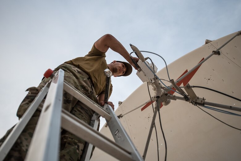 U.S. Air Force Staff Sgt. Joshua Foster, a radio frequency transmissions technician with the 379th Operations Support Squadron, uses a spectrum analyzer to perform diagnostics on a satellite at Al Udeid Air Base, Qatar, Mar. 30, 2018. Silent Sentry protects critical satellite communication links by employing multiple weapons systems for electronic warfare. (U.S. Air National Guard photo by Master Sgt. Phil Speck)