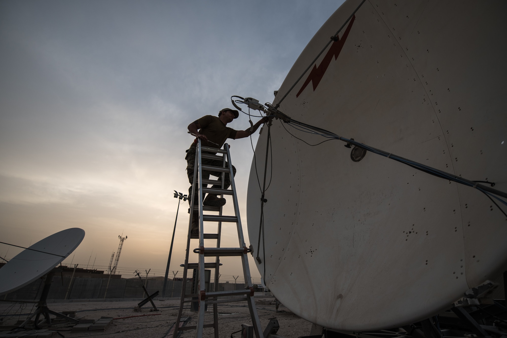 U.S. Air Force Staff Sgt. Joshua Foster, a radio frequency transmissions technician with the 379th Operations Support Squadron, uses a spectrum analyzer to perform diagnostics on a satellite at Al Udeid Air Base, Qatar, Mar. 30, 2018. Silent Sentry protects critical satellite communication links by employing multiple weapons systems for electronic warfare. (U.S. Air National Guard photo by Master Sgt. Phil Speck)