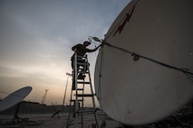 U.S. Air Force Staff Sgt. Joshua Foster, a radio frequency transmissions technician with the 379th Operations Support Squadron, uses a spectrum analyzer to perform diagnostics on a satellite at Al Udeid Air Base, Qatar, Mar. 30, 2018. Silent Sentry protects critical satellite communication links by employing multiple weapons systems for electronic warfare. (U.S. Air National Guard photo by Master Sgt. Phil Speck)