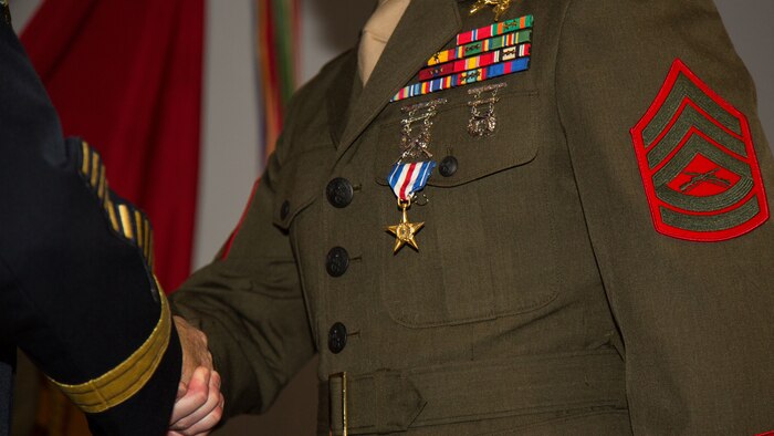 A critical skills operator with 3rd Marine Raider Battalion, Marine Raider Regiment, U.S. Marine Corps Forces, Special Operations Command, receives the Silver Star aboard Marine Corps Base Camp Lejeune, N.C., April 6, 2018.
