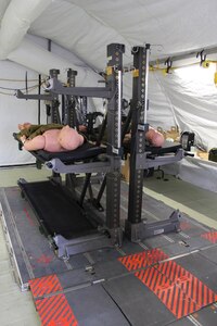 Lt. Col. Brandi Ritter, chief, Air Force Medical Evaluation Support Activity, demonstrates a field hospital lighting system at the AMESA test facility in Ft. Detrick, Md. on Feb. 15, 2018. AFMESA tested the lights to ensure they work in the field and can survive the rigors of deployment. (U.S. Air Force photo by Shireen Bedi)