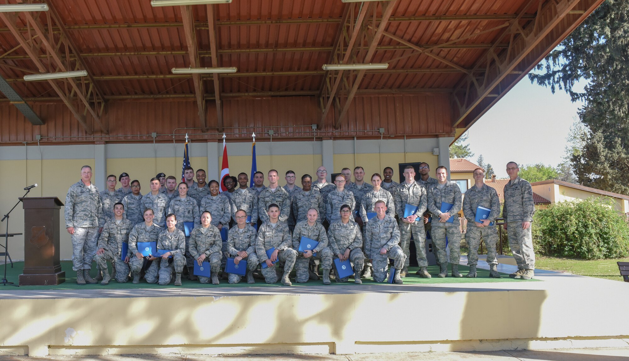 Airmen pose for photo after receiving medals