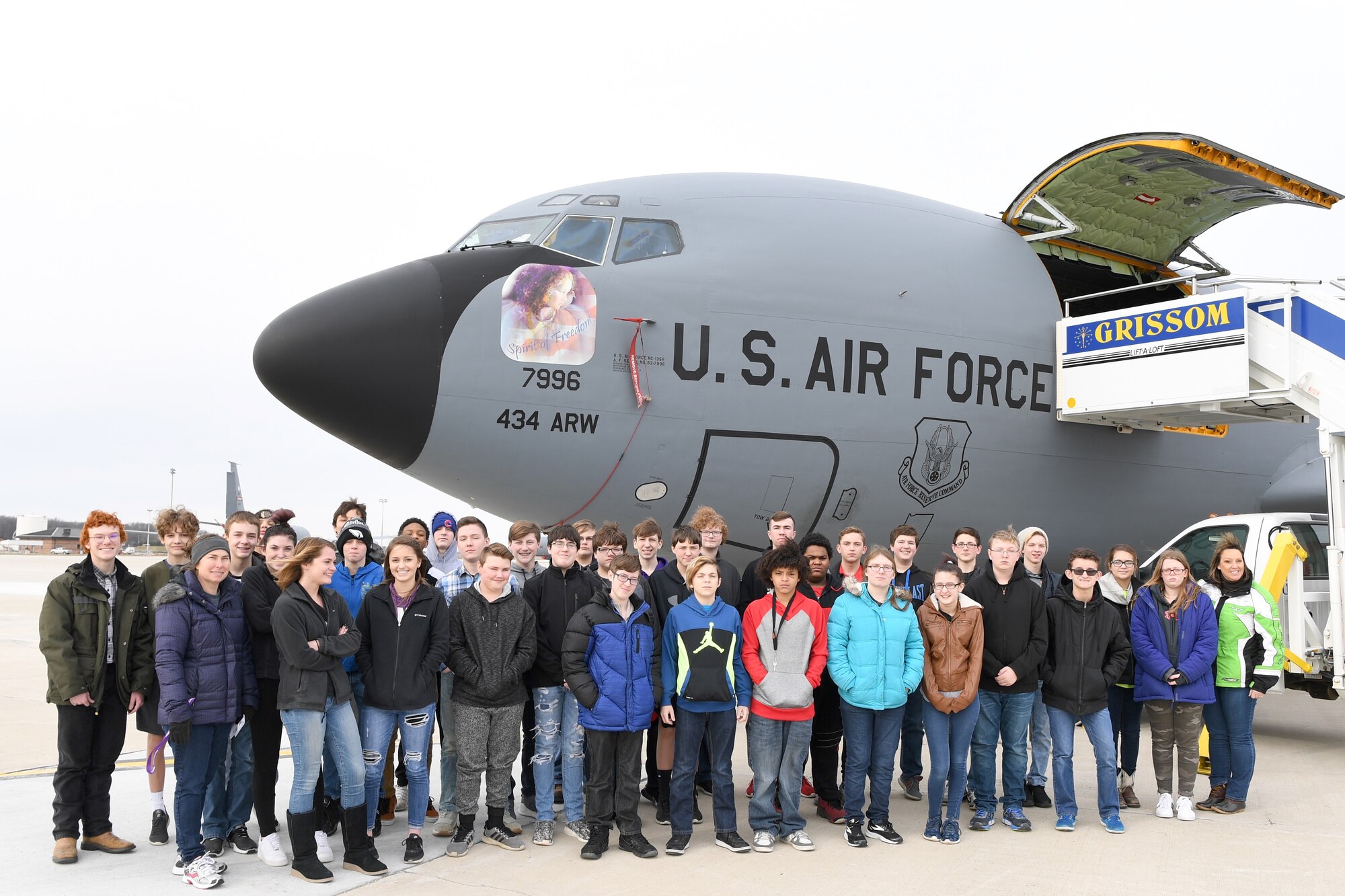 Students from Kokomo Indiana’s Northwestern Middle School pose for a photo in front of a 434th Air Refueling Wing KC-135 Stratotanker aircraft March 21, 2018. The school has brought 8th grade students to the base for the last 3 years to provide a hands on learning experience of the base and its mission. (U.S. Air Force Photo/Tech. Sgt. Benjamin Mota)