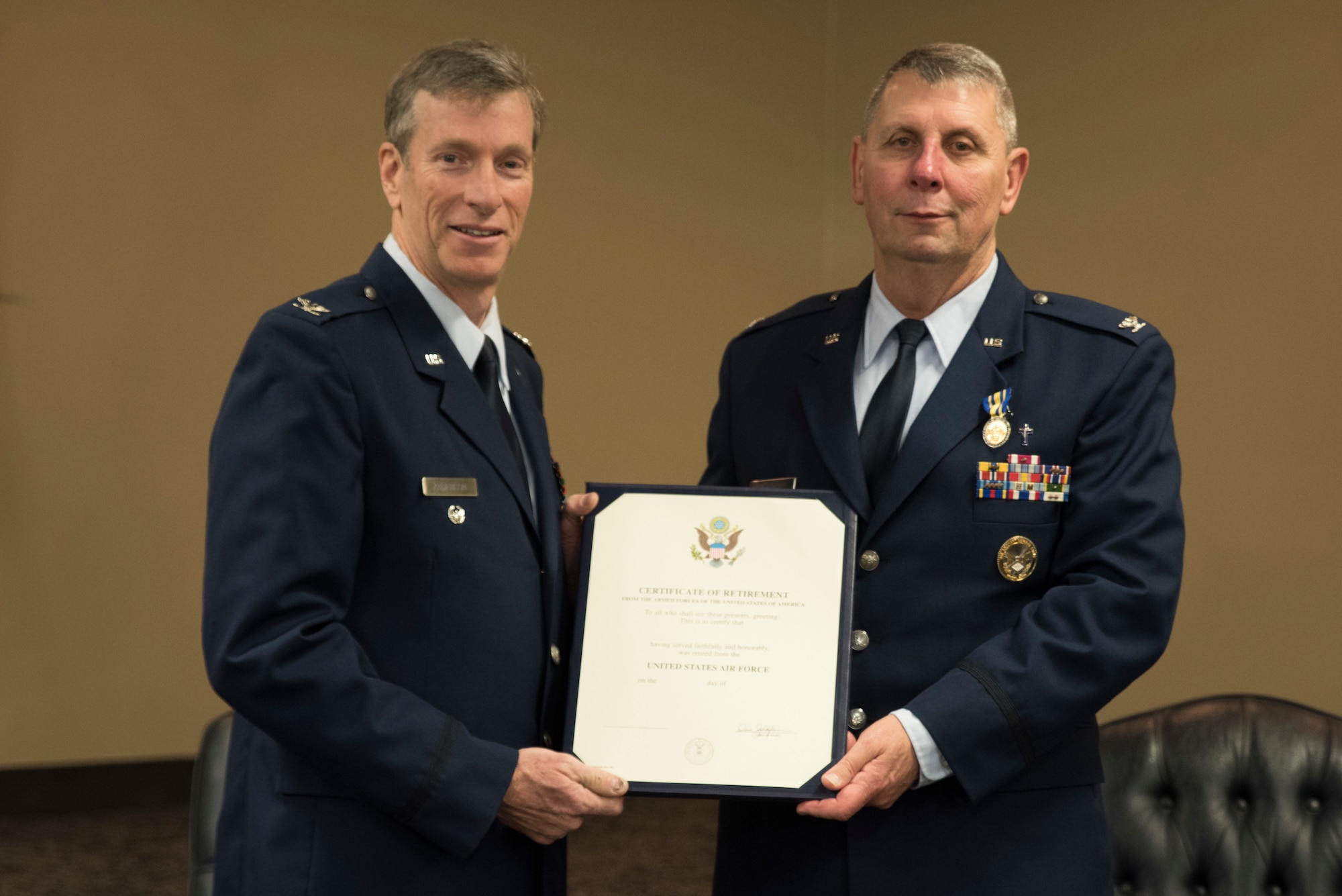 Retired Col. Mark W. Anderson, Former Commander 188th Wing, presents Col. Smith, retired, with his Certificate of Retirement at Fort Smith, AR., Apr. 07, 2018. (U.S. Air National Guard photo by Tech. Sgt. Daniel Condit)