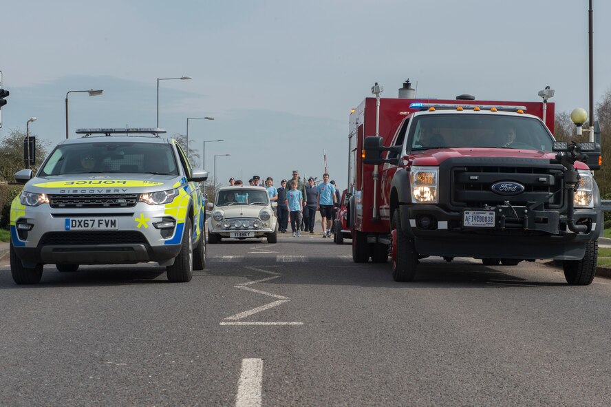 Members of the local community drive cars on base as part of the 100th RAF Baton Relay on RAF Fairford, April 6, 2018. The community came out to show support and celebrate the RAF birthday. (U.S. Air Force photo by Senior Airman Chase Sousa)