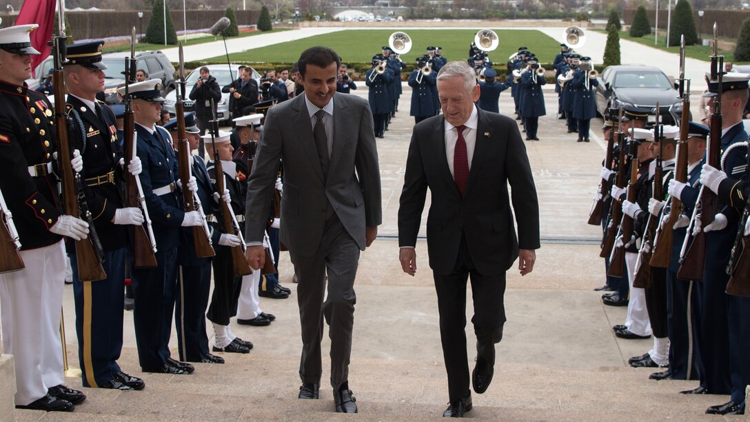 Defense Secretary James N. Mattis walks up steps with Sheikh Tamim bin Hamad Al Thani, emir of Qatar, outside the Pentagon.