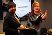 Carol Gallant (right), wife of Maj. Gen. Richard Gallant, commander of Joint Task Force Civil Support (JTF-CS), thanks Darlene Morgan (left), the community readiness specialist at Joint Base Langley-Eustis, for her assistance with the Key Spouse Group at JTF-CS during a tour and group meeting at Mullan Hall last month.  The Key Spouse Group is a commander's program that is primarily used in the Air Force. According to the US Air Force Services website, it's an official unit/family program designed to enhance readiness and establish a sense of community. After a tour of the headquarters, the spouses sat down to discuss the current group and where it is headed. A new command team is coming in July. Along with that big change, several key leaders are moving on to their next duty stations. That means more volunteers are needed to continue a program that the Gallant family agrees is critical to the command.