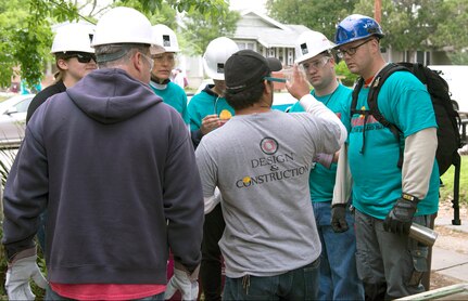 Members of the 502nd Air Base Wing receive a briefing from a construction foreman during the second annual REHABARAMA in the Highland Park neighborhood April 7. REHABARAMA is a one-day event that brings together volunteers, local contractors, students and neighborhood leaders to assist homeowners with exterior maintenance at no cost to the homeowner. Members of Joint Base San Antonio were among the 200 volunteers that took part in the second annual REHABARAMA in the Highland Park neighborhood, sponsored by the City of San Antonio’s Office of Historic Preservation.