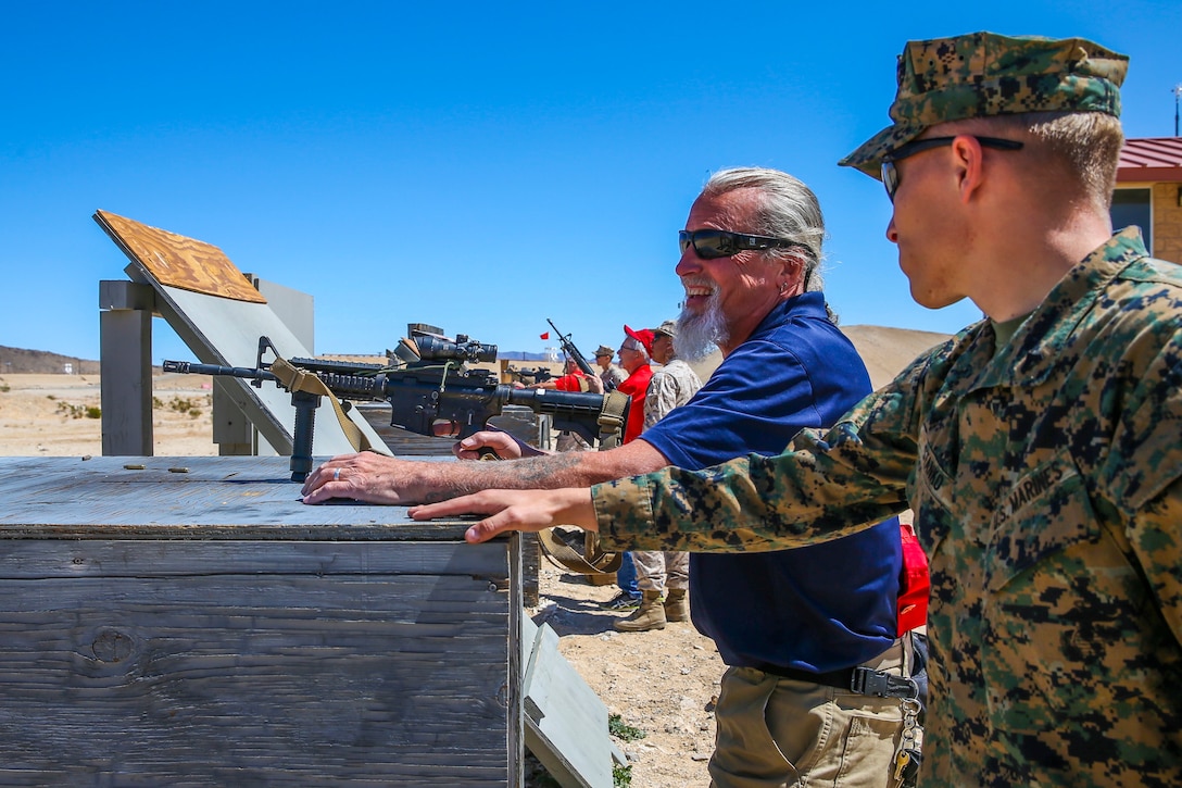 Marines with 7th Marine Regiment instruct veterans with the Desert Cities Mitchell Paige Medal of Honor Chapter, 1st Marine Division Association on the M16A4 service rifle, during an Alumni Day hosted by 7th Marine Regiment aboard the Marine Corps Air Ground Combat Center, Twentynine Palms, Calif., March 28, 2018. The day was hosted to cultivate and strengthen relationships between active-duty Marines and those who served. (U.S. Marine Corps photo by Lance Cpl. Rachel K. Porter)