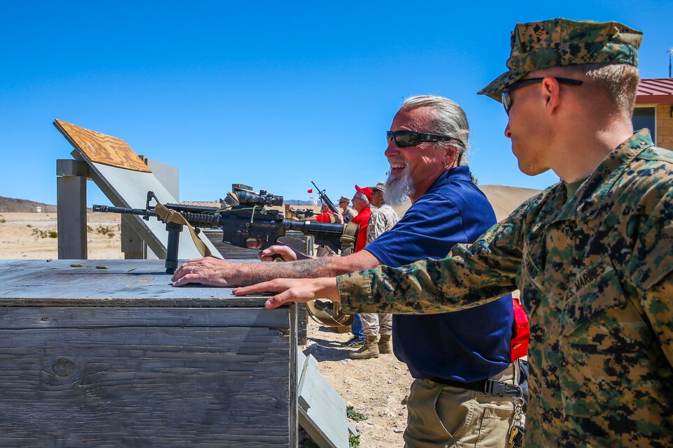 Marines with 7th Marine Regiment instruct veterans with the Desert Cities Mitchell Paige Medal of Honor Chapter, 1st Marine Division Association on the M16A4 service rifle, during an Alumni Day hosted by 7th Marine Regiment aboard the Marine Corps Air Ground Combat Center, Twentynine Palms, Calif., March 28, 2018. The day was hosted to cultivate and strengthen relationships between active-duty Marines and those who served. (U.S. Marine Corps photo by Lance Cpl. Rachel K. Porter)