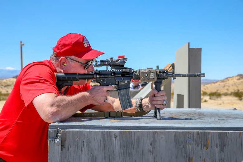 A veteran with the Desert Cities Mitchell Paige Medal of Honor Chapter, 1st Marine Division Association, participates in the live-fire rifle shoot during an Alumni Day hosted by 7th Marine Regiment aboard the Marine Corps Air Ground Combat Center, Twentynine Palms, Calif., March 28, 2018. The day was hosted to cultivate and strengthen relationships between active-duty Marines and those who served. (U.S. Marine Corps photo by Lance Cpl. Rachel K. Porter)