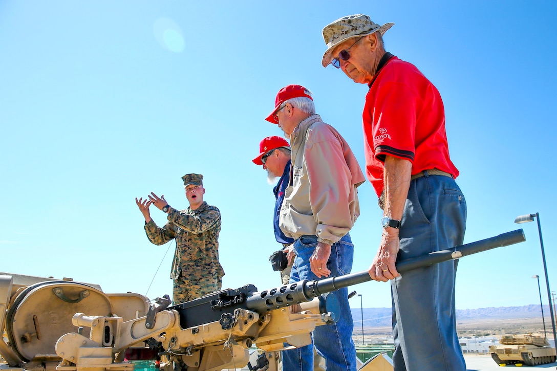 Veterans with the Desert Cities Mitchell Paige Medal of Honor Chapter, 1st Marine Division Association, admire the tanks of today’s Marine Corps during an Alumni Day hosted by 7th Marine Regiment aboard the Marine Corps Air Ground Combat Center, Twentynine Palms, Calif., March 28, 2018. The day was hosted to cultivate and strengthen relationships between active-duty Marines and those who served. (U.S. Marine Corps photo by Lance Cpl. Rachel K. Porter)