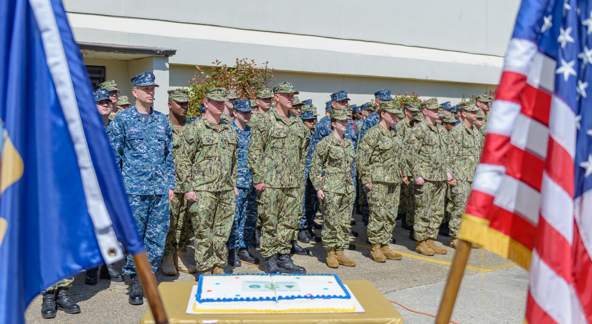 Center for Naval Aviation Technical Training Unit Keesler personnel stand in formation as opening remarks were given during the CNATTU Keesler’s Chief Petty Officer Birthday Ceremony at Keesler Air Force Base, Mississippi, April 5, 2018. The U.S. Navy’s Chief Petty Officers are celebrating 125 years of heritage and the naval tradition of Unity, Service and Navigation, which is part of their rate emblem, is symbolized by a fouled anchor with the letters “USN” centered on the anchor. (U.S. Air Force photo by André Askew)