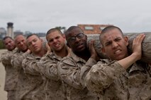 Recruits with India Company, 3rd Recruit Training Battalion, carry a log during a log drill exercise at Marine Corps Recruit Depot San Diego, April 2. Each exercise helped recruits develop cardiovascular endurance and prepare for future physical endeavors. Annually, more than 17,000 males recruited from the Western Recruiting Region are trained at MCRD San Diego. India Company is scheduled to graduate May 25.