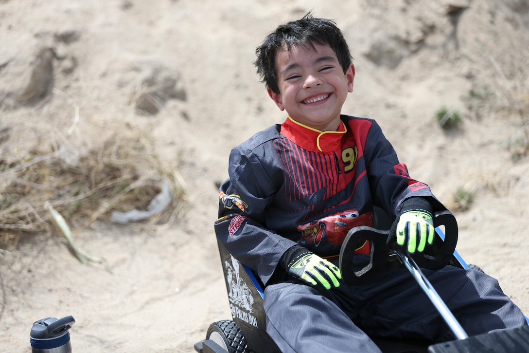 Nathaniel Nieves, 5, son of Gunnery Sgt. Joel A. Nieves, data chief, Tactical Training Exercise Control Group, prepares to participate in the soapbox derby during the 18th Annual Car Show and Street Fair, which was hosted by the Twentynine Palms Chamber of Commerce in Twentynine Palms, Calif., March 31, 2018. The annual event is used to bring the community of Twentynine Palms and the Marine Corps Air Ground Combat Center, located in Twentynine Palms, together as well as support local businesses. (U.S. Marine Corps photo by Lance Cpl. Rachel K. Porter)