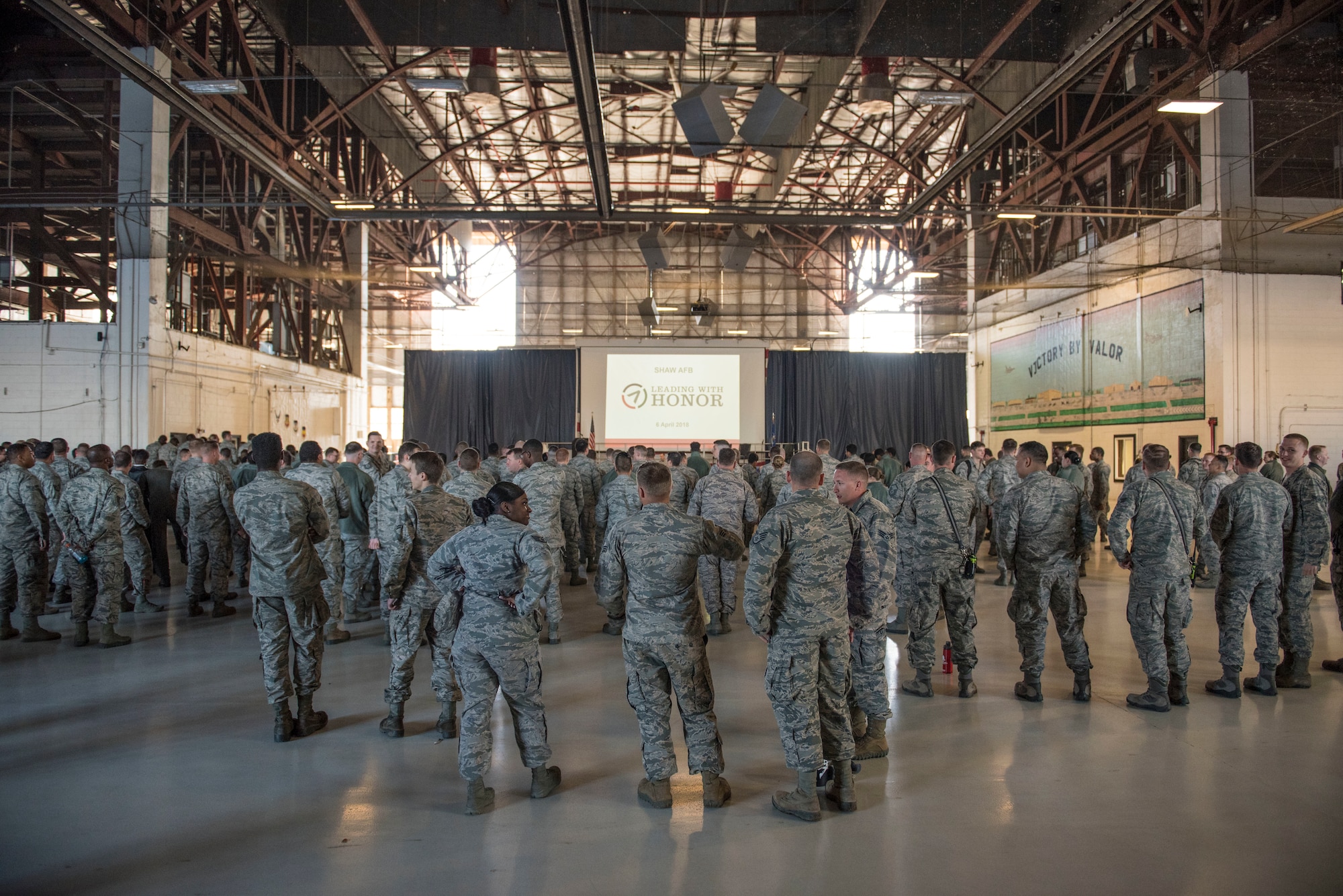 Team Shaw members gather for a brief from retired U.S. Air Force Col. Lee Ellis, Vietnam War pilot and former prisoner of war, at Shaw Air Force Base, S.C., April 6, 2018.