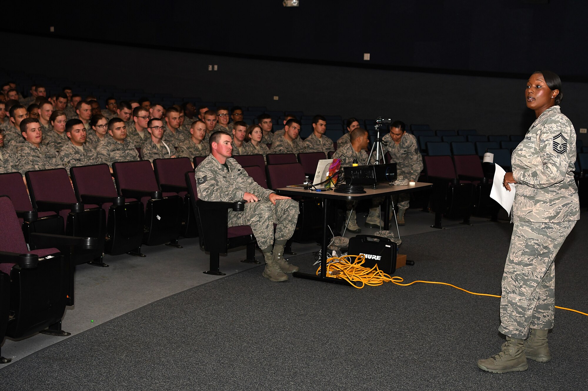 U.S. Air Force Senior Master Sgt. Tiffany Patterson, 81st Force Support Squadron career assistance advisor, speaks to Airmen during the Airmen Building Airmen Symposium at the Welch Theater at Keesler Air Force Base, Mississippi, April 6, 2018. The symposium also included a question and answer panel and a video. The symposium was held to empower Airmen and help them understand the impact they have on the future of the Air Force. (U.S. Air Force photo by Airman 1st Class Suzie Plotnikov)