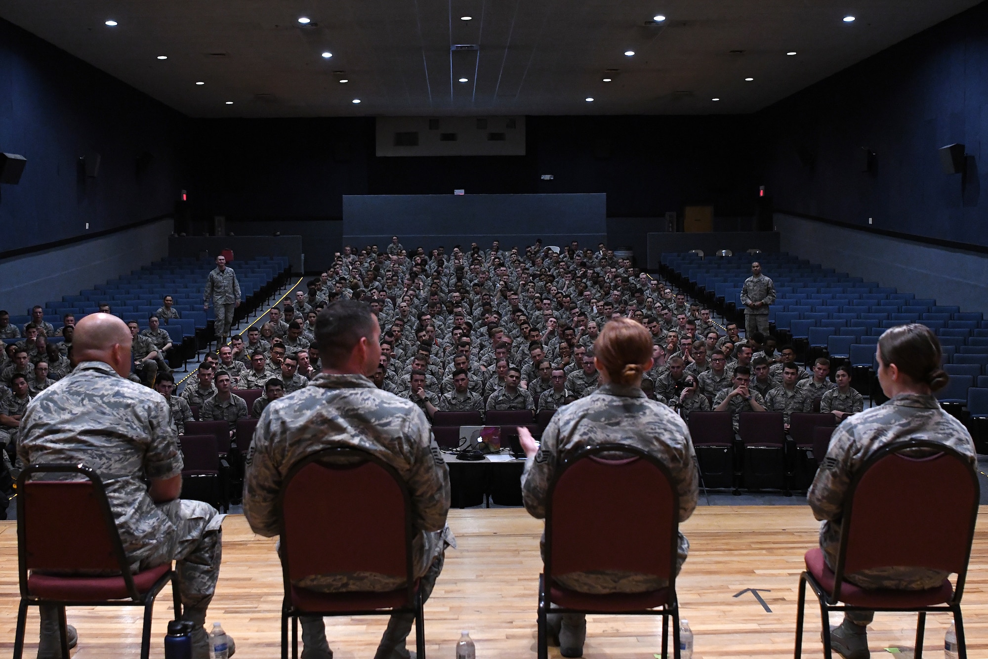 A discussion panel answers questions during the Airmen Building Airmen Symposium at the Welch Theater at Keesler Air Force Base, Mississippi, April 6, 2018. The symposium also included a guest speaker and a video. The symposium was held to empower Airmen and help them understand the impact they have on the future of the Air Force. (U.S. Air Force photo by Airman 1st Class Suzie Plotnikov)