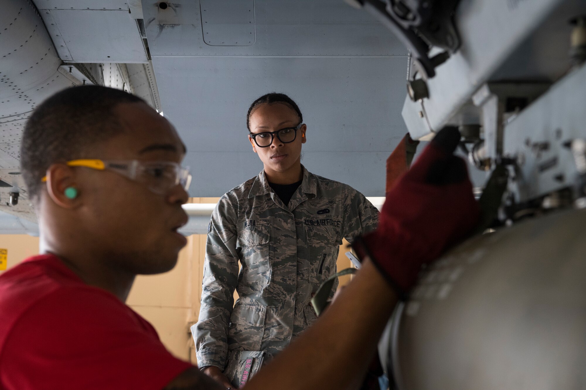 Airman 1st Class Maleek Hurd, 75th Aircraft Maintenance Unit (AMU) weapons load crew member, secures an inert munition during a weapons load competition, April 9, 2018, at Moody Air Force Base, Ga. The 75th and 74th AMUs went head to head with each crew competing to load three munitions onto an A-10 quicker and with less discrepancies than the other. Crews were also judged on dress and appearance and a written test based on munitions knowledge. (U.S. Air Force photo by Senior Airman Janiqua P. Robinson)
