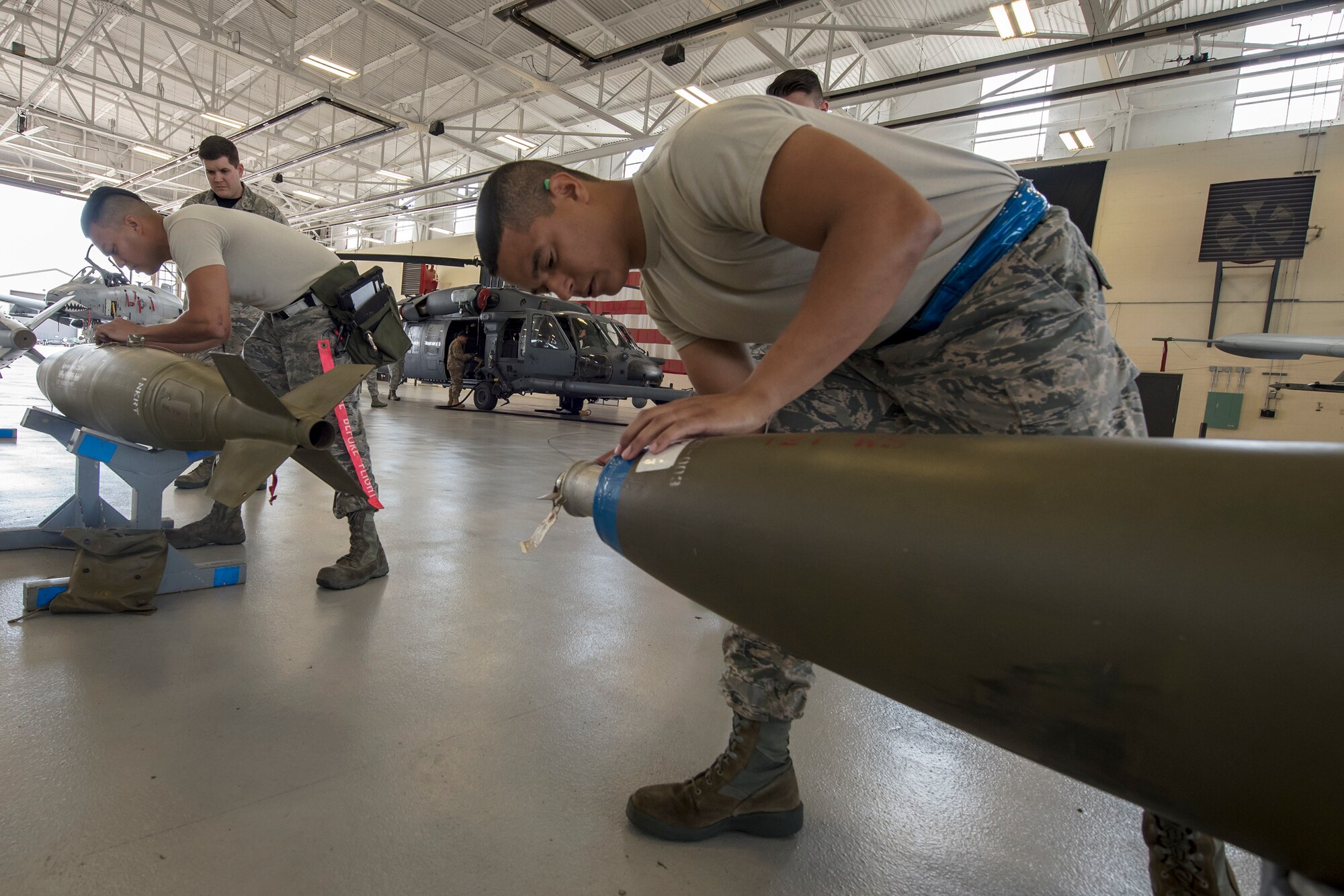 Senior Airman Luis Batista-Mercedes, right, 74th Aircraft Maintenance Unit (AMU) weapons load crew member and Staff Sgt. Jorge Galvez, 74th AMU weapons load crew team chief, check the umbilical component on inert MK-84 general purpose bombs during a weapons-load competition, April 6, 2018, at Moody Air Force Base, Ga. During the load portion of the competition Airmen from the 74th and 75th AMU were assessed on their ability to quickly and efficiently load munitions onto an A-10. They were also judged on dress and appearance and a written test based on munitions knowledge. (U.S. Air Force photo by Airman Eugene Oliver)