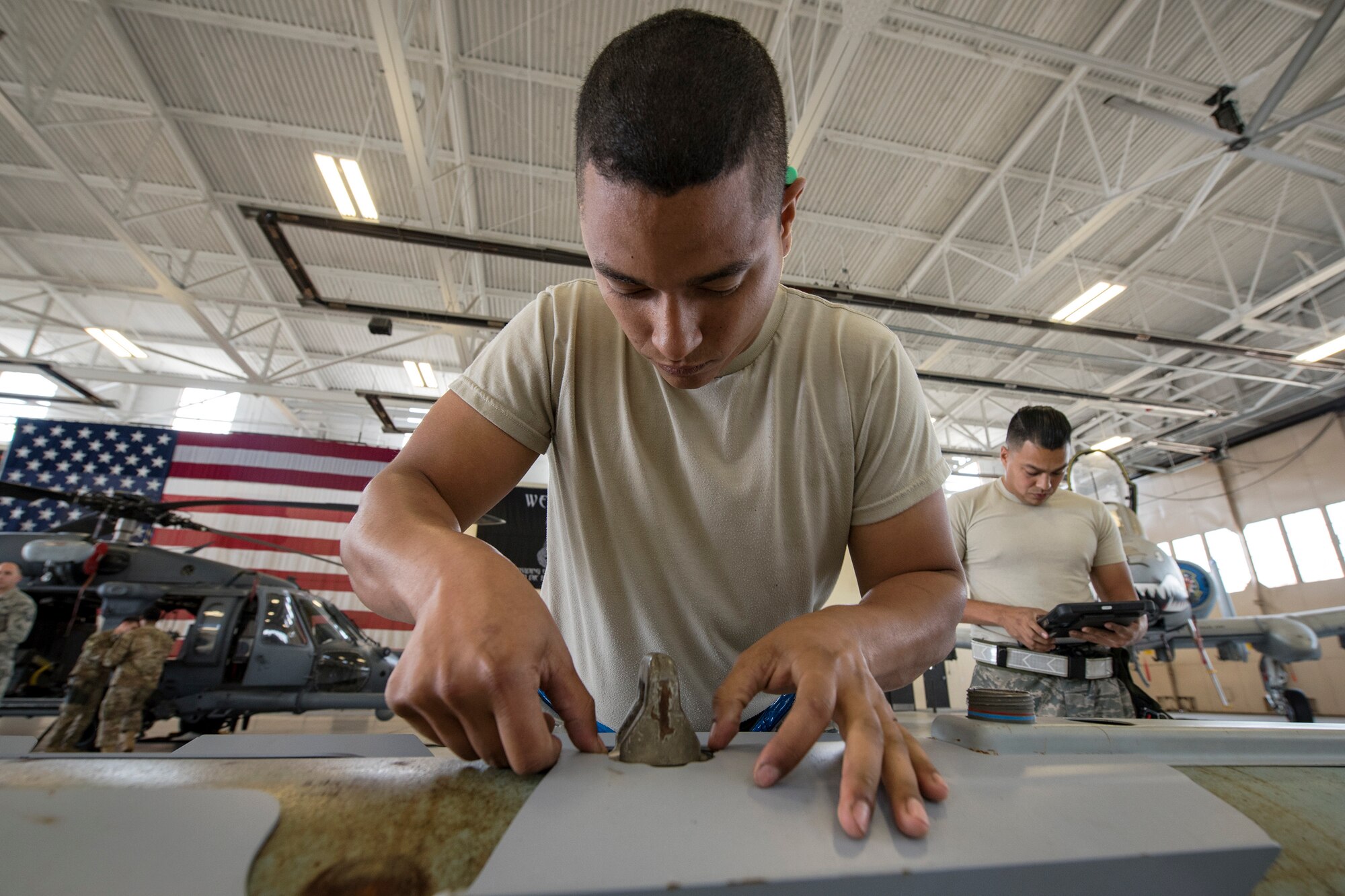 Senior Airman Luis Bautista-Mercedes, 74th Aircraft Maintenance Unit (AMU) weapons load crew member, checks an umbilical on an MK-84 general purpose bomb during a weapons-load competition, April 6, 2018, at Moody Air Force Base, Ga. During the load portion of the competition Airmen from the 74th and 75th AMU were assessed on their ability to quickly and efficiently load munitions onto an A-10. They were also judged on dress and appearance and a written test based on munitions knowledge. (U.S. Air Force photo by Airman Eugene Oliver)