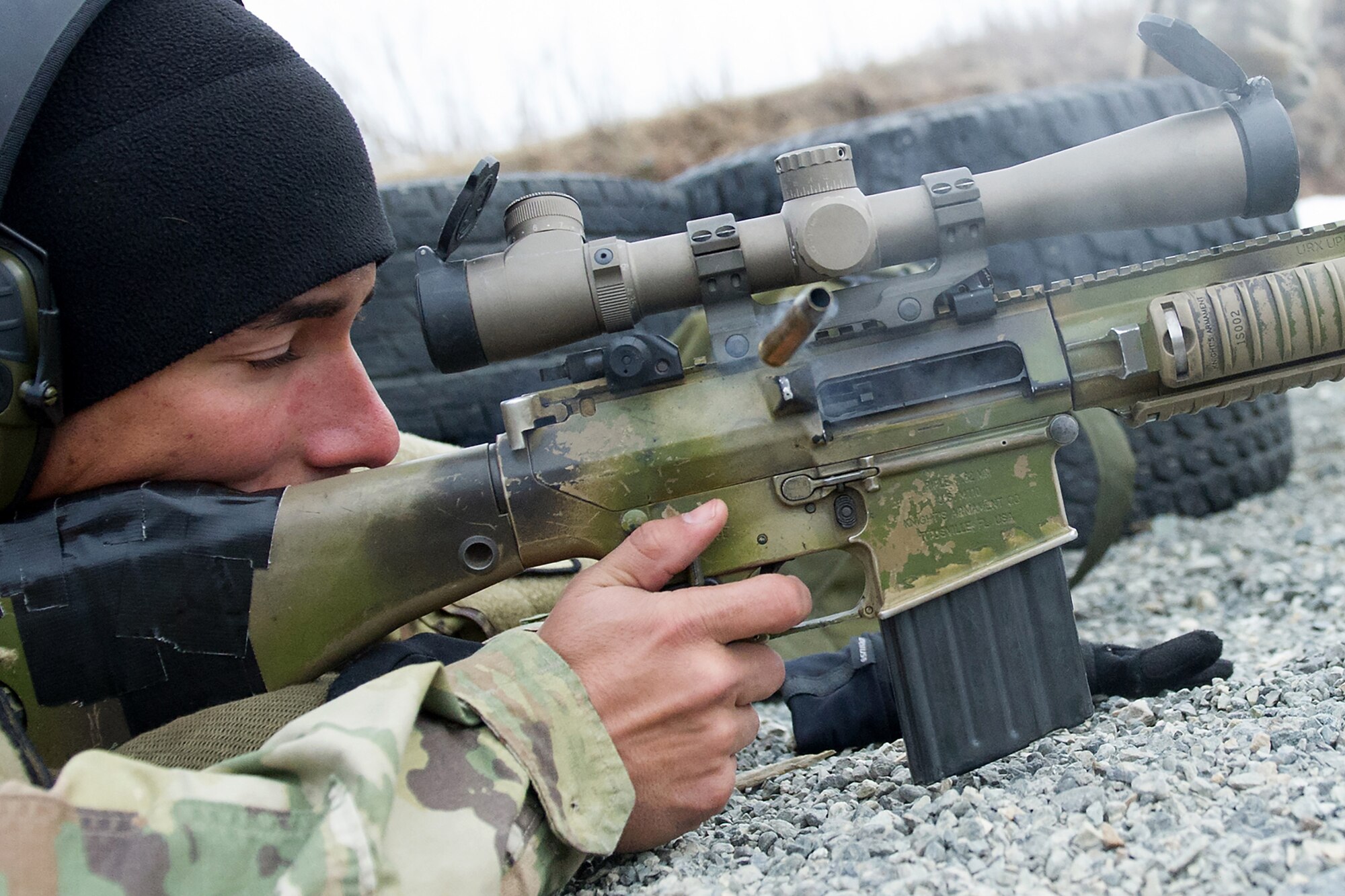 Army Spc. Arturo Dominguez, a native of Okeechobee, Fla., assigned to Charlie Troop, 1st Squadron, 40th Cavalry Regiment (Airborne), 4th Infantry Brigade Combat Team (Airborne), 25th Infantry Division, U.S. Army Alaska, fires at a target in the prone position with his M110 Semi-Automatic Sniper System on Statler range at Joint Base Elmendorf-Richardson, Alaska, April 6, 2018, during marksmanship training.  A sniper's main responsibility is to deliver discriminatory, highly accurate rifle fire against enemy targets that cannot be engaged successfully by the regular rifleman due to range, size, location, fleeting nature, or visibility.