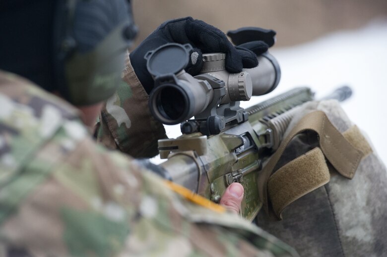 Army Spc. Arturo Dominguez, a native of Okeechobee, Fla., assigned to Charlie Troop, 1st Squadron, 40th Cavalry Regiment (Airborne), 4th Infantry Brigade Combat Team (Airborne), 25th Infantry Division, U.S. Army Alaska, adjusts the scope on his M110 Semi-Automatic Sniper System on Statler range at Joint Base Elmendorf-Richardson, Alaska, April 6, 2018, during marksmanship training.  A sniper's main responsibility is to deliver discriminatory, highly accurate rifle fire against enemy targets that cannot be engaged successfully by the regular rifleman due to range, size, location, fleeting nature, or visibility.
