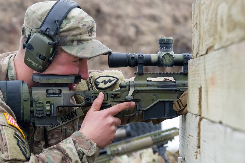 Army Spc. Eric Haugh, a native of Graham, Wash., assigned to Charlie Troop, 1st Squadron, 40th Cavalry Regiment (Airborne), 4th Infantry Brigade Combat Team (Airborne), 25th Infantry Division, U.S. Army Alaska, lines up a traget with a M2010 Enhanced Sniper Rifle on Statler range at Joint Base Elmendorf-Richardson, Alaska, April 6, 2018, during marksmanship training.  A sniper's main responsibility is to deliver discriminatory, highly accurate rifle fire against enemy targets that cannot be engaged successfully by the regular rifleman due to range, size, location, fleeting nature, or visibility.