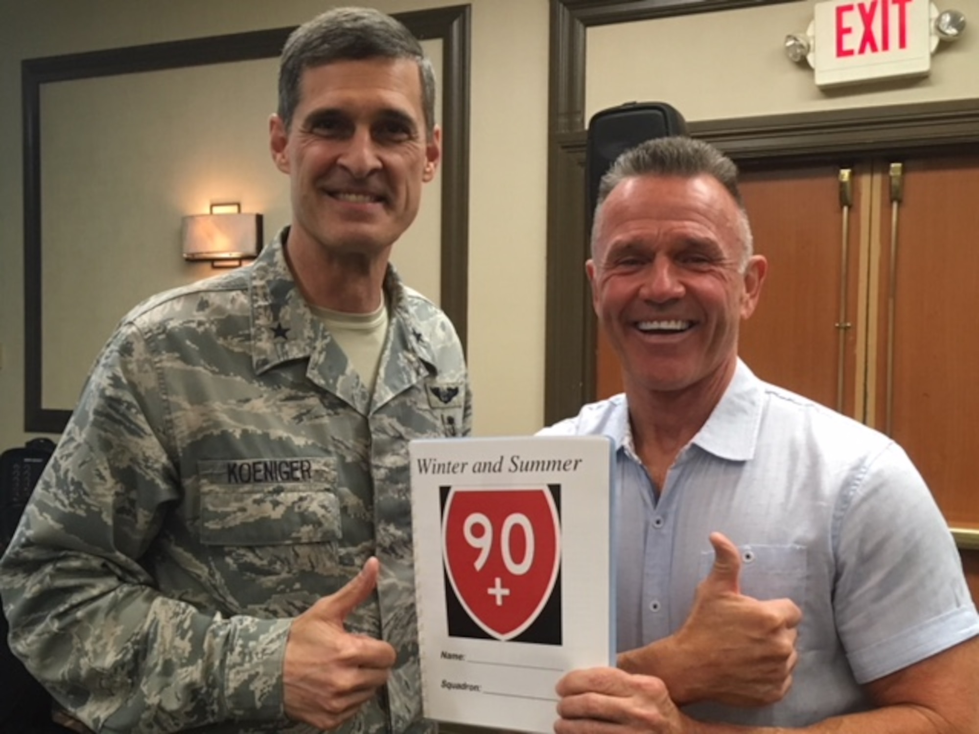 John Walters, 436th Force Support Squadron fitness program manager, poses with Brig. Gen. Mark Koeniger, 711th Human Performance Wing commander, at the Air Force Medical Service Operational Integrated Support meeting March 27, 2018, in San Antonio, Texas. Walter presented the history, scope, goals and metrics of the 90+ program during the meeting. (courtesy photo)