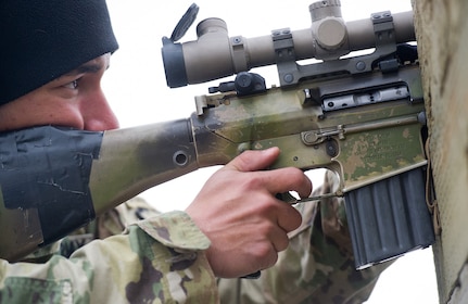 Army Spc. Arturo Dominguez, a native of Okeechobee, Fla., assigned to Charlie Troop, 1st Squadron, 40th Cavalry Regiment (Airborne), 4th Infantry Brigade Combat Team (Airborne), 25th Infantry Division, U.S. Army Alaska, aims at a target with a M110 Semi-Automatic Sniper System on Statler range at Joint Base Elmendorf-Richardson, Alaska, April 6, 2018, during marksmanship training.  A sniper's main responsibility is to deliver discriminatory, highly accurate rifle fire against enemy targets that cannot be engaged successfully by the regular rifleman due to range, size, location, fleeting nature, or visibility.