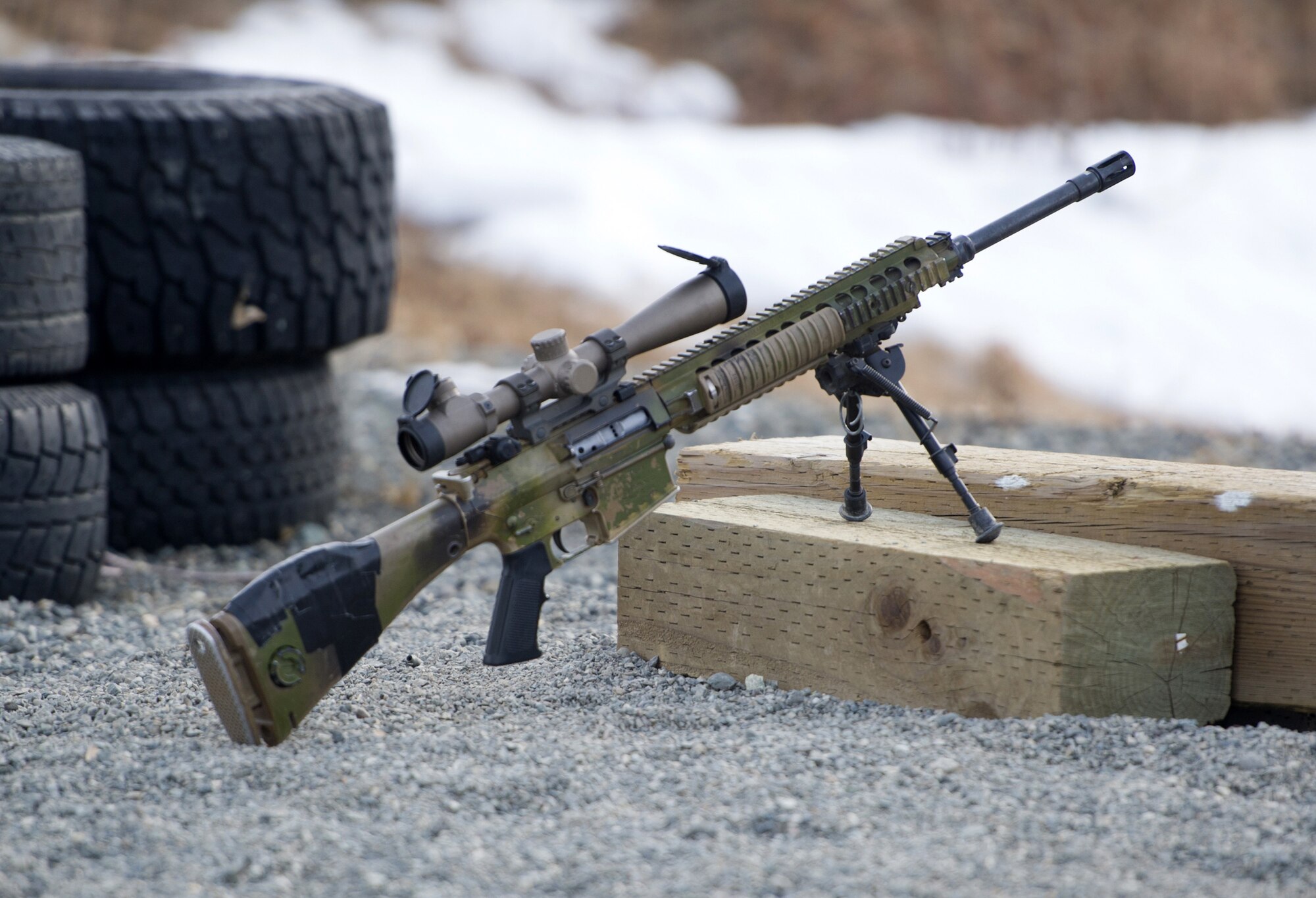 A M110 Semi-Automatic Sniper System sits on the firing line on Statler range at Joint Base Elmendorf-Richardson, Alaska, before paratroopers assigned to the 1st Squadron, 40th Cavalry Regiment (Airborne), 4th Infantry Brigade Combat Team (Airborne), 25th Infantry Division, U.S. Army Alaska, hone marksmanship skills, April 6, 2018.  A sniper's main responsibility is to deliver discriminatory, highly accurate rifle fire against enemy targets that cannot be engaged successfully by the regular rifleman due to range, size, location, fleeting nature, or visibility.
