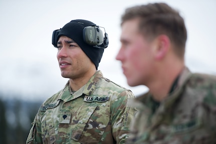 Army Spc. Arturo Dominguez, a native of Okeechobee, Fla., assigned to Charlie Troop, 1st Squadron, 40th Cavalry Regiment (Airborne), 4th Infantry Brigade Combat Team (Airborne), 25th Infantry Division, U.S. Army Alaska, listens to a instruction before training with his M110 Semi-Automatic Sniper System on Statler range at Joint Base Elmendorf-Richardson, Alaska, April 6, 2018, during marksmanship training.  A sniper's main responsibility is to deliver discriminatory, highly accurate rifle fire against enemy targets that cannot be engaged successfully by the regular rifleman due to range, size, location, fleeting nature, or visibility.