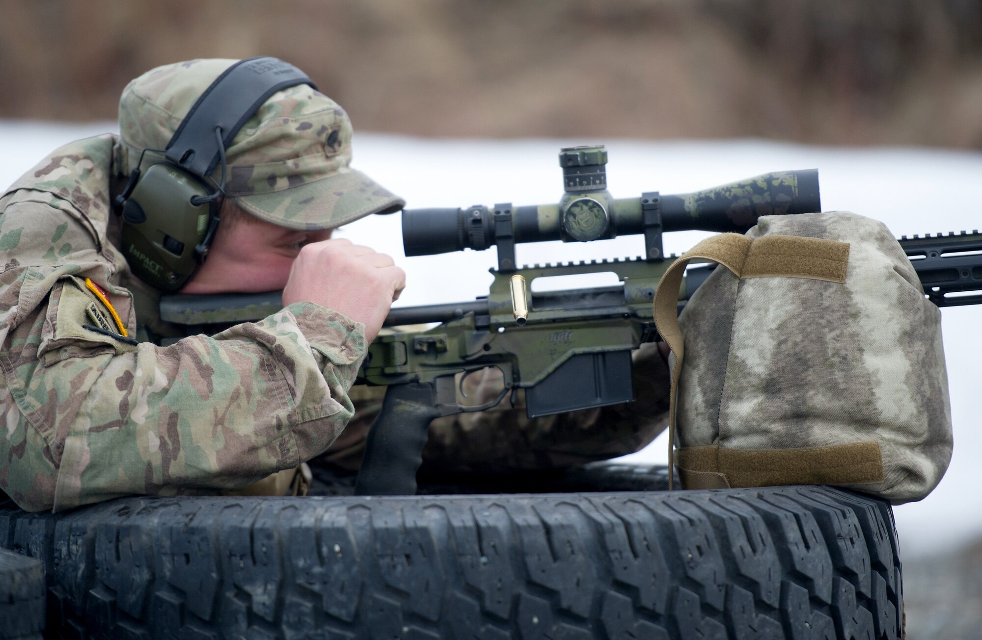 Army Spc. Eric Haugh, a native of Graham, Wash., assigned to Charlie Troop, 1st Squadron, 40th Cavalry Regiment (Airborne), 4th Infantry Brigade Combat Team (Airborne), 25th Infantry Division, U.S. Army Alaska, ejects a cartridge from his M2010 Enhanced Sniper Rifle on Statler range at Joint Base Elmendorf-Richardson, Alaska, April 6, 2018, during marksmanship training.  A sniper's main responsibility is to deliver discriminatory, highly accurate rifle fire against enemy targets that cannot be engaged successfully by the regular rifleman due to range, size, location, fleeting nature, or visibility.