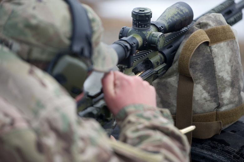 Army Spc. Eric Haugh, a native of Graham, Wash., assigned to Charlie Troop, 1st Squadron, 40th Cavalry Regiment (Airborne), 4th Infantry Brigade Combat Team (Airborne), 25th Infantry Division, U.S. Army Alaska, seats a new round into his M2010 Enhanced Sniper Rifle on Statler range at Joint Base Elmendorf-Richardson, Alaska, April 6, 2018, during marksmanship training.  A sniper's main responsibility is to deliver discriminatory, highly accurate rifle fire against enemy targets that cannot be engaged successfully by the regular rifleman due to range, size, location, fleeting nature, or visibility.