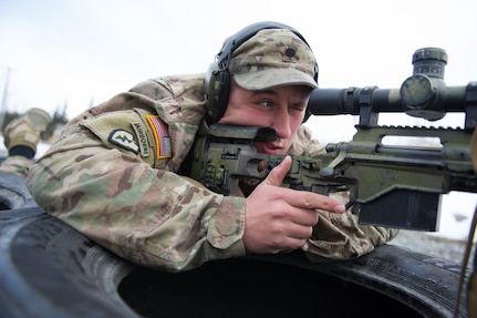 Army Spc. Eric Haugh, a native of Graham, Wash., assigned to Charlie Troop, 1st Squadron, 40th Cavalry Regiment (Airborne), 4th Infantry Brigade Combat Team (Airborne), 25th Infantry Division, U.S. Army Alaska, aims at a target with his M2010 Enhanced Sniper Rifle on Statler range at Joint Base Elmendorf-Richardson, Alaska, April 6, 2018, during marksmanship training.  A sniper's main responsibility is to deliver discriminatory, highly accurate rifle fire against enemy targets that cannot be engaged successfully by the regular rifleman due to range, size, location, fleeting nature, or visibility.