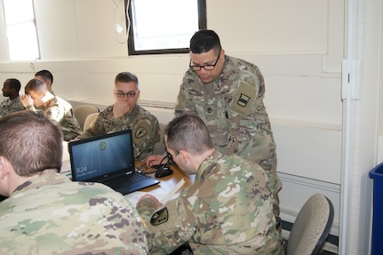 (Standing) Sgt. 1st Class Heriberto Rivera-Cassanova, an 80th Training Command instructor, teaches Army Reserve and National Guard Soldiers measurement calculations as part of the 12R Interior Electrician course at The Army School System Training Center Dix, New Jersey, March 31, 2018.