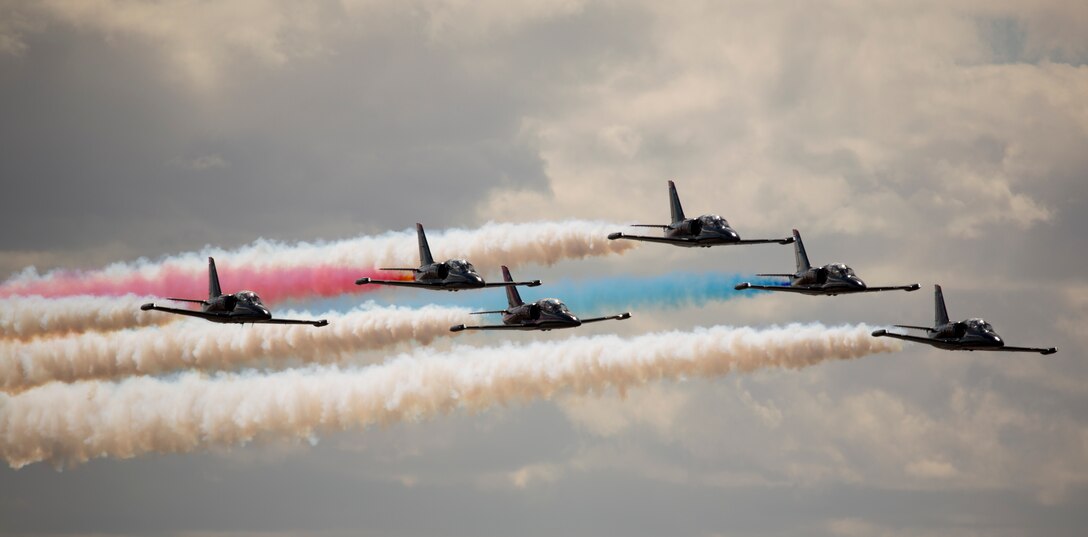 The 2018 Yuma Airshow headliner, The Patriots Jet Team, perform an acrobatic aerial display for spectators during the 2018 Yuma Airshow hosted by Marine Corps Air Station Yuma, Ariz., Saturday, March 17, 2018. The Patriots Jet Team, the largest civilian-owned aerobatic jet team in the western hemisphere, began with the vision of one person: Randy Howell. Fueled by passion for aviation since childhood, it became Howell's mission to create a six-jet precision demonstration team that could entertain, inspire, and educate. The airshow is MCAS Yuma's only military airshow of the year and provides the community an opportunity to see thrilling aerial and ground performers for free while interacting with Marines and Sailors. (U.S. Marine Corps photo by Lance Cpl. Sabrina Candiaflores)