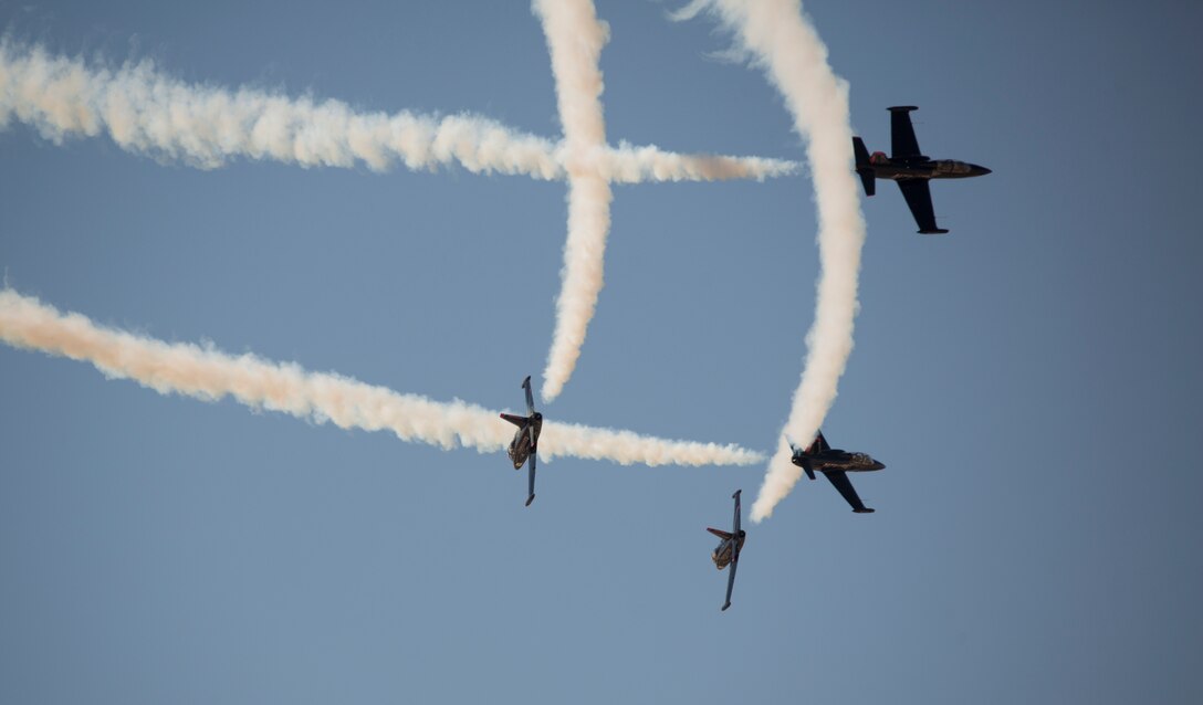 The 2018 Yuma Airshow headliner, The Patriots Jet Team, perform an acrobatic aerial display for spectators during the 2018 Yuma Airshow hosted by Marine Corps Air Station Yuma, Ariz., Saturday, March 17, 2018. The Patriots Jet Team, the largest civilian-owned aerobatic jet team in the western hemisphere, began with the vision of one person: Randy Howell. Fueled by passion for aviation since childhood, it became Howell's mission to create a six-jet precision demonstration team that could entertain, inspire, and educate. The airshow is MCAS Yuma's only military airshow of the year and provides the community an opportunity to see thrilling aerial and ground performers for free while interacting with Marines and Sailors. (U.S. Marine Corps photo by Lance Cpl. Sabrina Candiaflores)