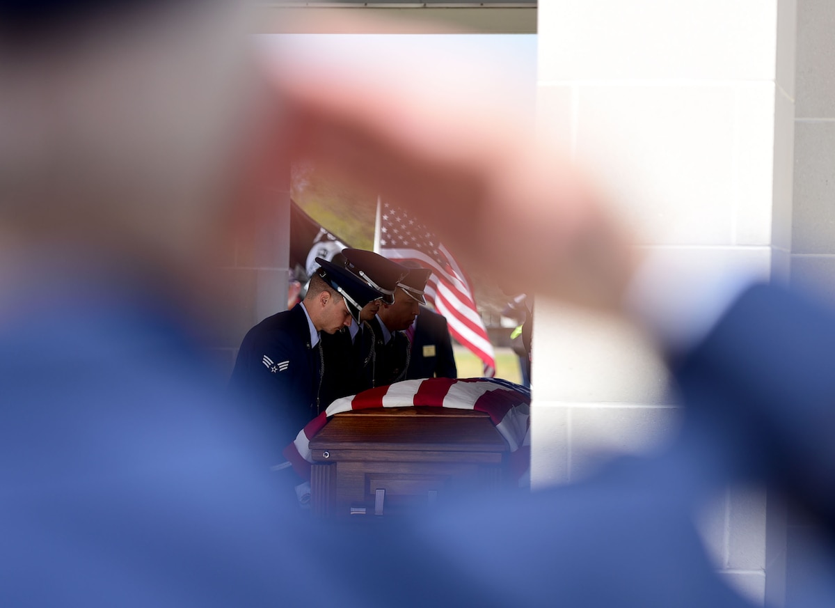 Col. Richard Dickins, 4th Operations Group commander, salutes Col. Edgar Davis as the Seymour Johnson Air Force Base Honor Guard transfers his remains April 6, 2018, Goldsboro, North Carolina. The funeral ceremony was held 50 years after Davis was shot down during a photo-reconnaissance mission over Laos. (U.S. Air Force photo by Senior Airman Christian Clausen)