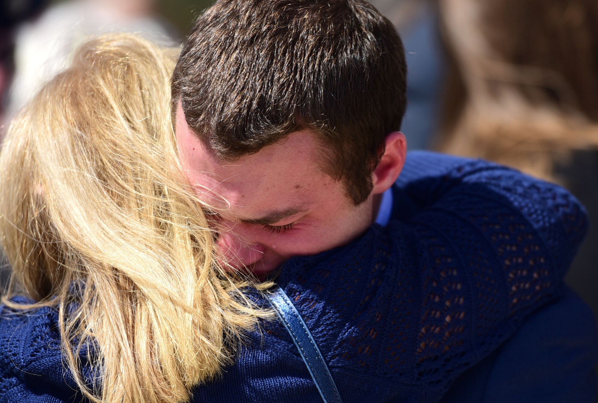 Matt Davis, grandson of Col. Edgar Davis embraces a family member after his grandfather’s funeral ceremony April 6, 2018, Goldsboro, North Carolina. Davis served as an RF-4C Phantom navigator during the Vietnam War assigned to the 11th Tactical Reconnaissance Squadron. The unit exists today as the 11th Attack Squadron flying the MQ-9 Reaper. (U.S. Air Force photo by Senior Airman Christian Clausen)