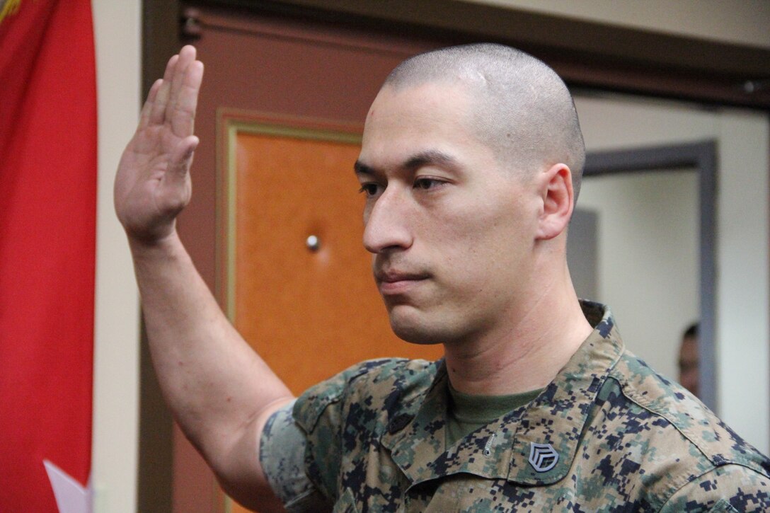 Staff Sgt. Michael J. Hoffman, engineer chief for U.S. Marine Corps Forces Korea, completes his Oath of Enlistment during his reenlistment ceremony here, April 6.  MARFORK celebrated Hoffman’s reenlistment and commitment to four more years in the Marine Corps.  Hoffman first enlisted in 2008. (Official U.S. Marine Corps photo by Sgt. Nathaniel Hanscom/Released)