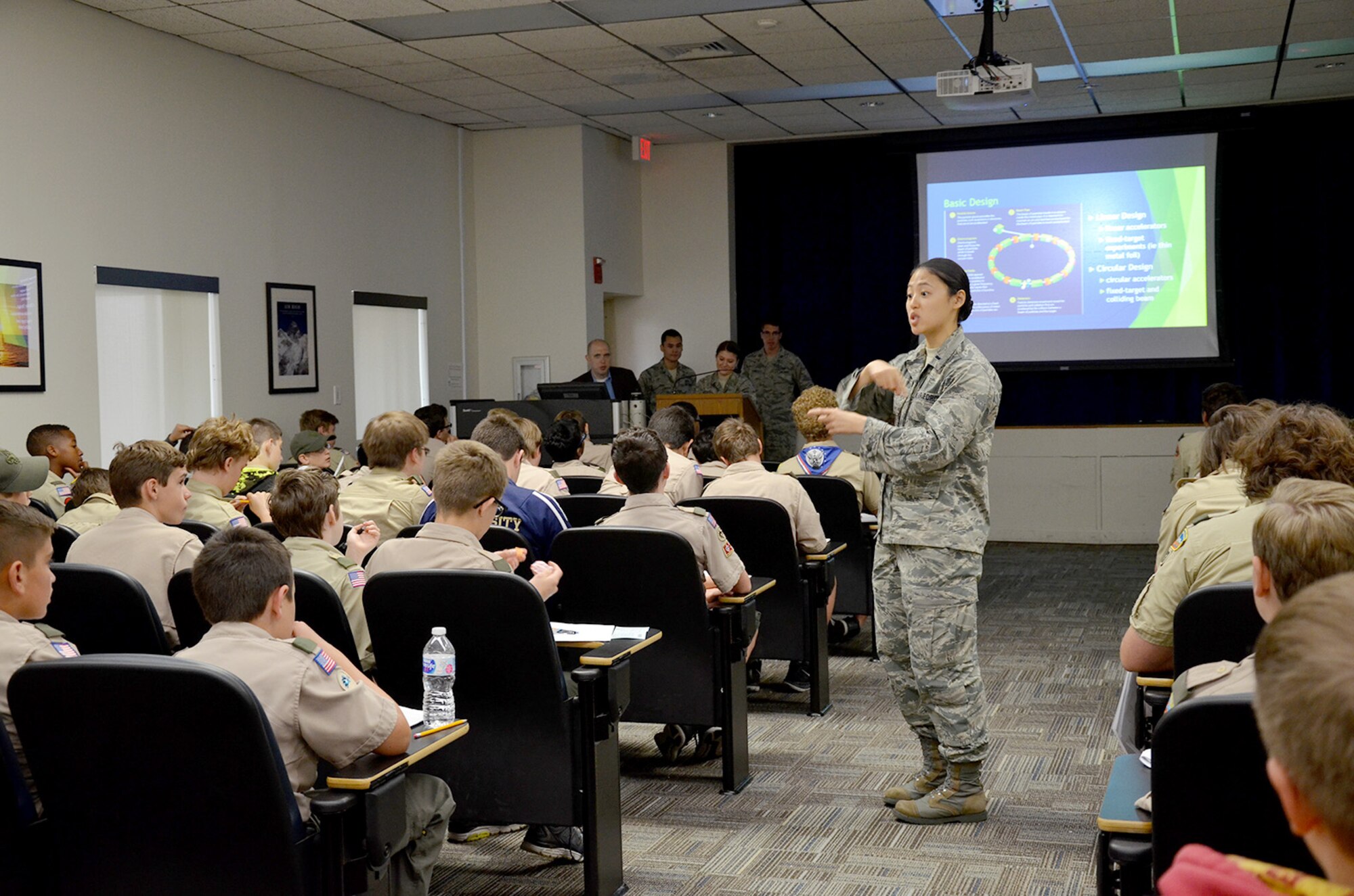 First Lt. Pamela Zhang, a chemist with the Air Force Technical Applications Center, describes how a particle accelerator works to a group of Boy Scouts from Central Florida.  Zhang was one of several volunteers from the nuclear treaty monitoring center who volunteered to help the scouts earn their Nuclear Science Merit Badge March 31, 2018.  (U.S. Air Force photo by Susan A. Romano)