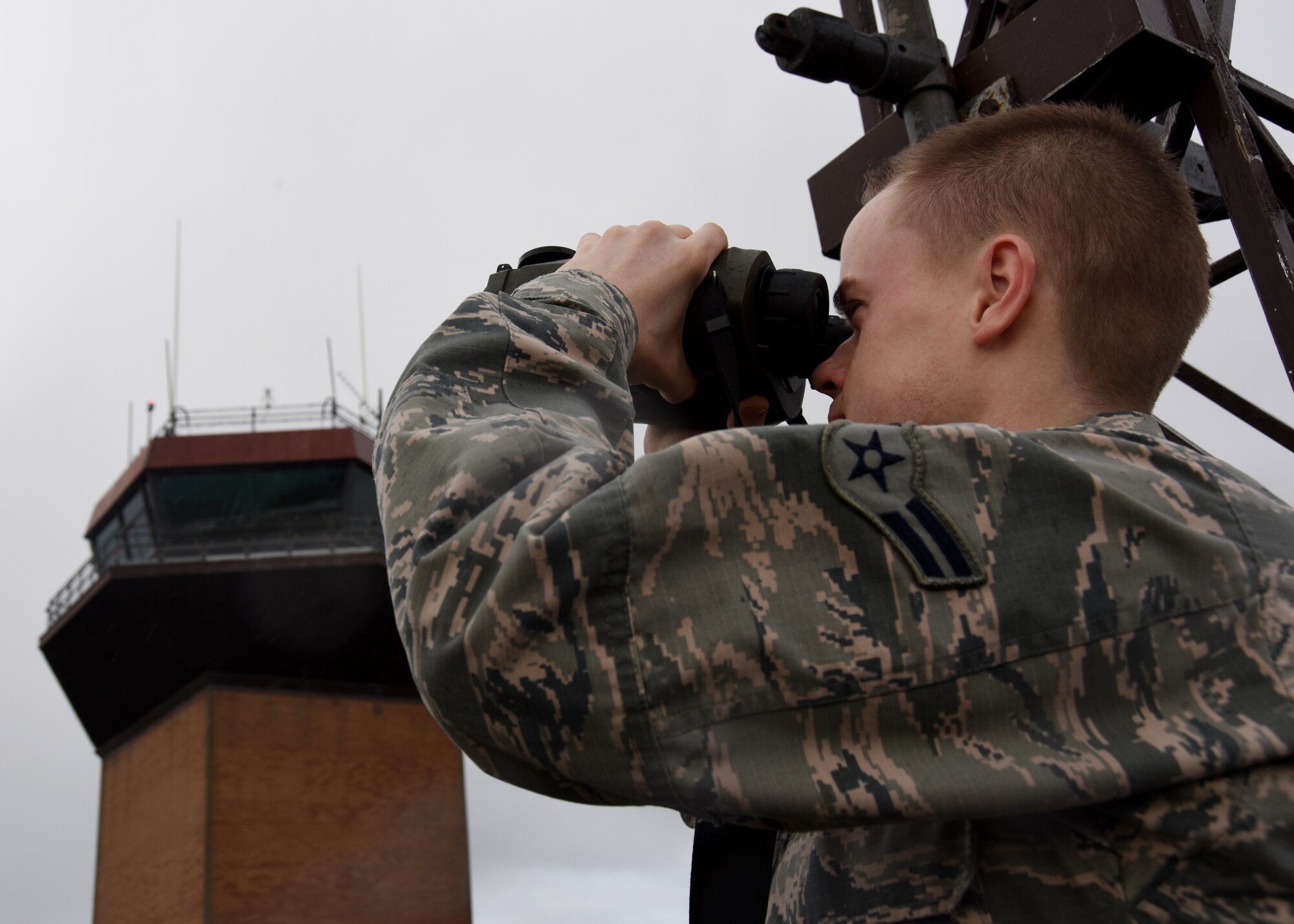 A 48th Operations Support Squadron weather forecaster uses a laser range finder at Royal Air Force Lakenheath, England, March 20. LRFs allow the forecasters to determine how low clouds are and measure the visibility range. Airmen utilize the tools available to keep aircrews apprised of the local weather so they can stay safe before, during and after each flight. (U.S. Air Force photo/Senior Airman Abby L. Finkel)