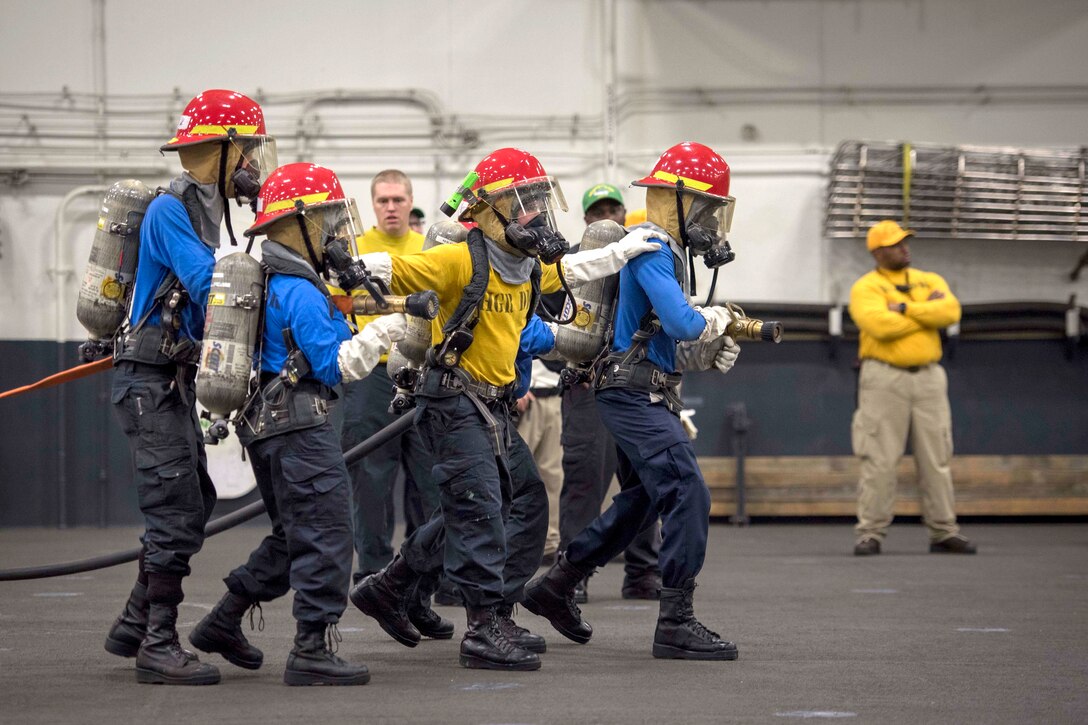 Sailors practice stepping in unison.