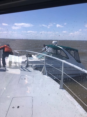 Crew aboard the Survey Vessel CATLETT help a boater come aboard from his disabled vessel in the Chesapeake Bay during a rescue operation Thursday April 5, 2018. The CATLETT’s U.S. Army Corps of Engineers crew was conducting a routine condition survey of the Tolchester Channel when she responded to a mayday call, rescuing the boater and bringing him back to the Corps of Engineers’ facility at Fort McHenry where local emergency medical services assisted him further.