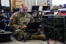 Soldier works on a computer