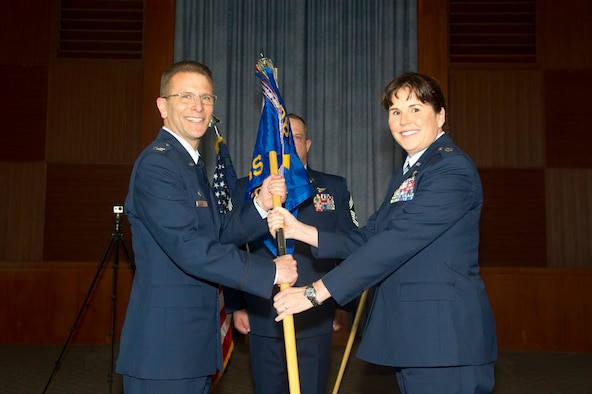 Lt. Col. Summer A. Fields takes the 13th Reconnaissance Squadron guidon from Col. David S. Edwards, 726th Operations Group commander at Creech Air Force Base, Nevada, April 7 at Beale Air Force Base, California.