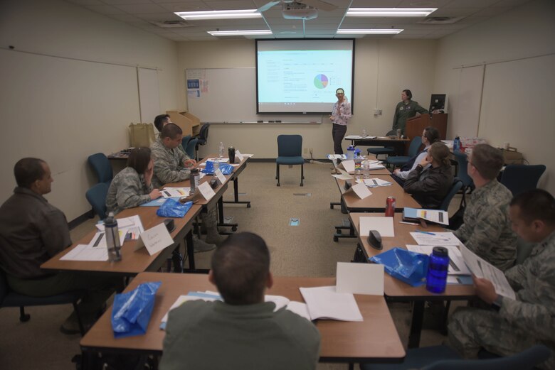 Flight Commander Course participants listen during a financial planning brief, April 5, 2018, at McConnell Air Force Base, Kansas. The course involved speaking with several panels and agencies from around base to learn how to become effective supervisors. (U.S. Air Force photo by Senior Airman Chris Thornbury)