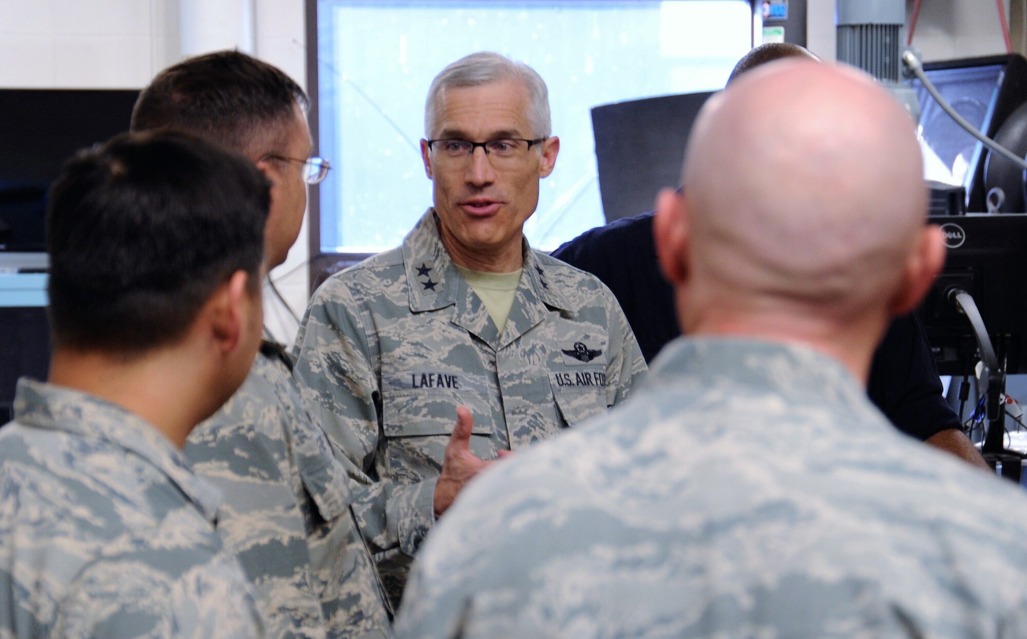 Maj. Gen. Craig La Fave, the 22nd Air Force commander, listens to 302nd Airlift Wing reservists during his tour of the wing’s aircraft maintenance facilities at Peterson Air Force Base, Colorado, April 8, 2018. La Fave spent part of the morning learning about the squadron’s challenges and accomplishments. (U.S. Air Force photo by Staff Sgt. Frank Casciotta)
