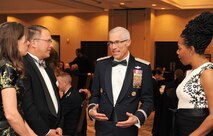 Maj. Gen. Craig La Fave, the 22nd Air Force commander, speaks with Steve Kaczmarek the Pikes Peak Community College foundation board president, his wife, Christy, left, and Dr. Regina Lewis, the PPCC Department of Communications chair, during the 302nd Airlift Wing’s 2017 Annual Awards Banquet held in Colorado Springs, Colorado, April 7, 2018. The Reserve wing celebrated the Air Force Reserve 70th Anniversary in addition to recognizing its top performers at this year's banquet. (U.S. Air Force photo by Staff Sgt. Frank Casciotta)